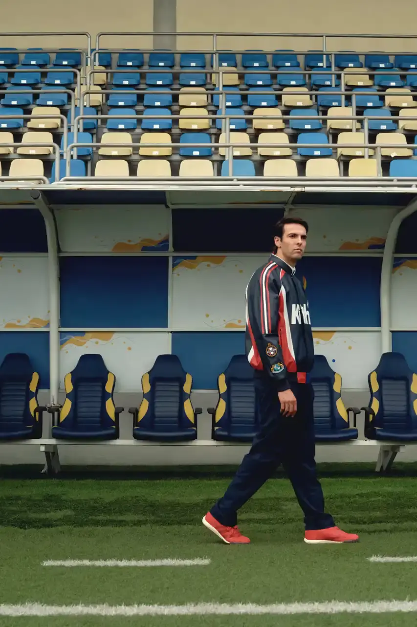 KITH AND ADIDAS FOOTBALL REUNITE AFTER SEVEN-YEAR HIATUS This article announces the Spring 2025 collaboration between Kith and adidas Football after a seven-year hiatus. The collection includes premium apparel (stadium coats, tracksuits, jerseys), footwear (custom Predator models and lifestyle options), and accessories (scarves, bags, headwear). Special collaborations with ESPN, Chase, and DHL Express are highlighted. The full collection launches April 18 online and in Kith retail locations. The article is structured in six paragraphs that outline the collaboration's scope, key apparel pieces, special partnerships, footwear offerings, accessories, and release details. (image 3 of 20)