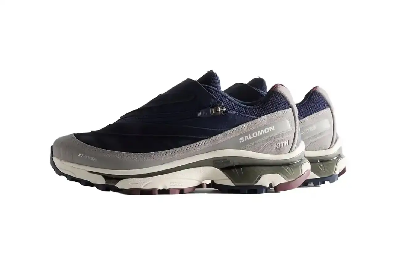 Kith Kith x Salomon XT-Voyager sneaker shown from side angle, featuring blue, grey, white and red colorway with distinctive zipper closure system. (image 12 of 12)