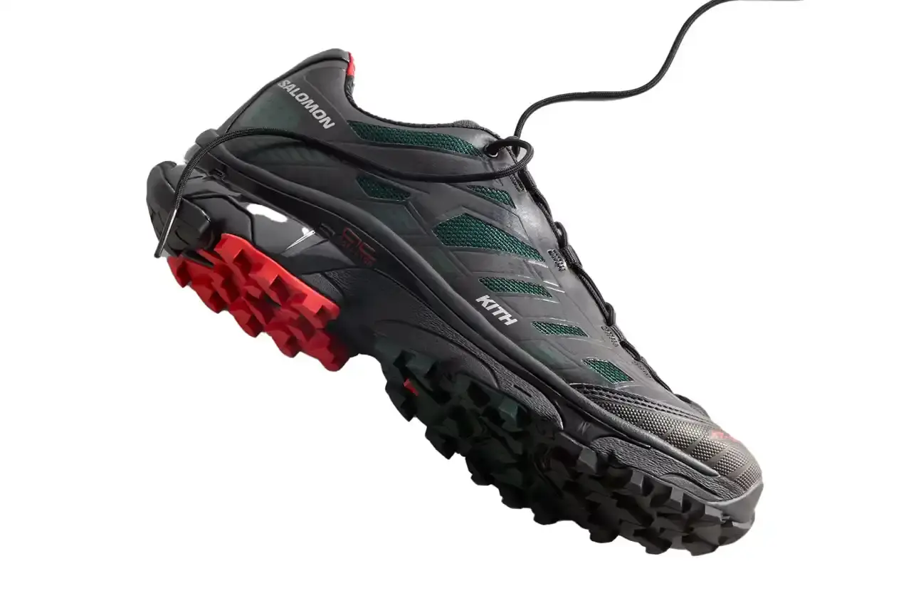 Kith Kith x Salomon XT-Voyager sneaker shown from side angle, featuring blue, grey, white and red colorway with distinctive zipper closure system. (image 6 of 12)