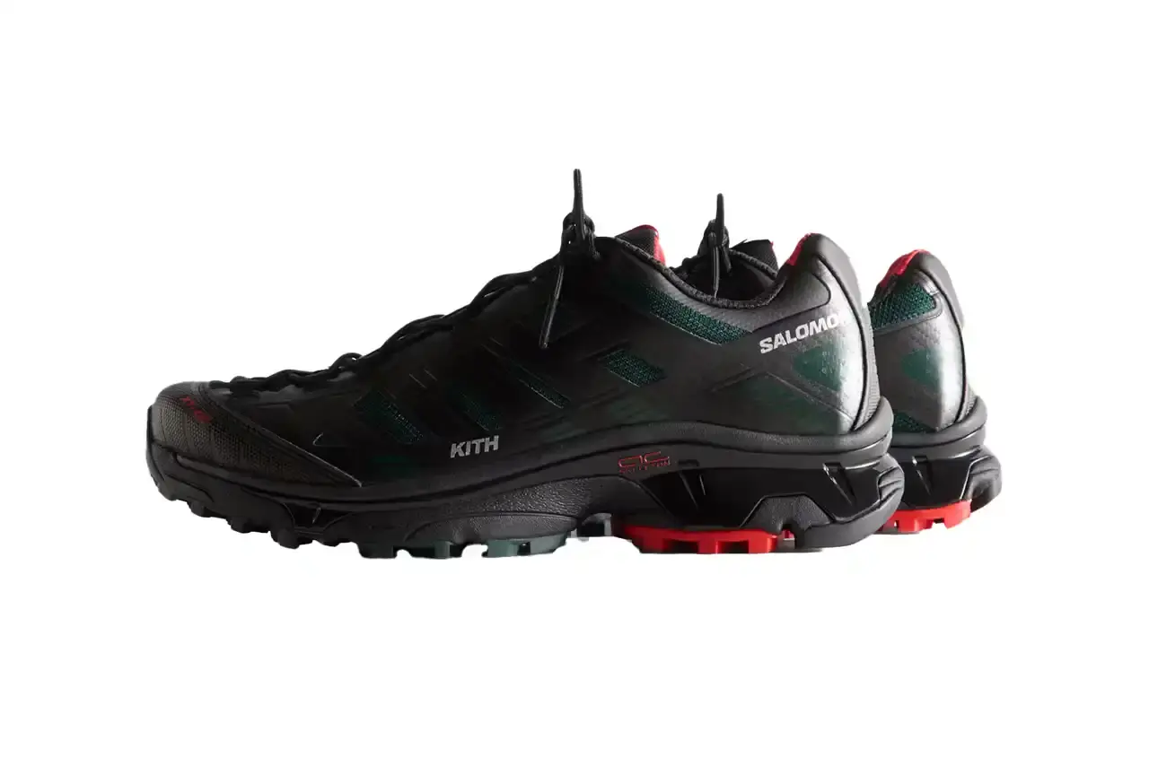 Kith Kith x Salomon XT-Voyager sneaker shown from side angle, featuring blue, grey, white and red colorway with distinctive zipper closure system. (image 7 of 12)