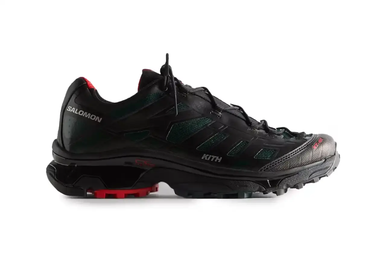 Kith Kith x Salomon XT-Voyager sneaker shown from side angle, featuring blue, grey, white and red colorway with distinctive zipper closure system. (image 8 of 12)