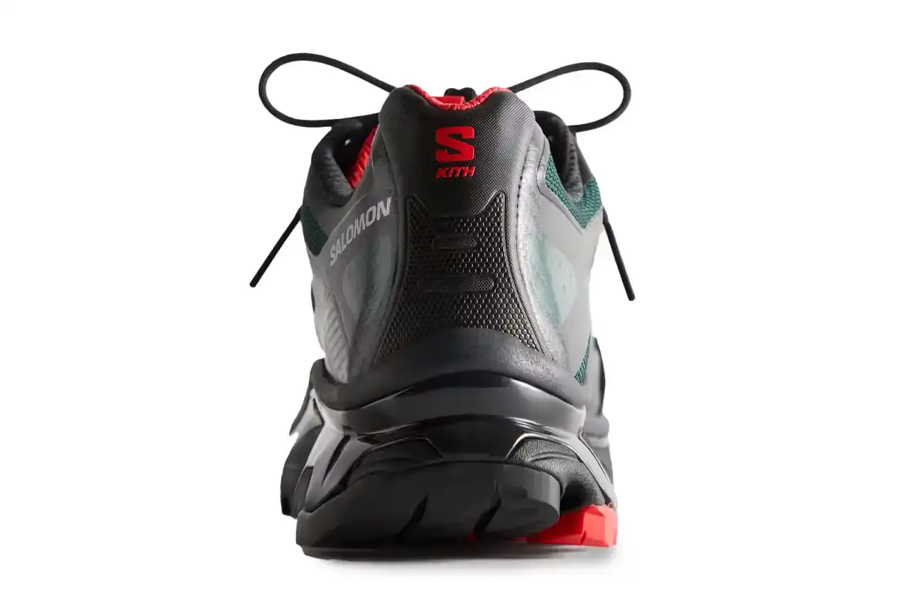 Kith Kith x Salomon XT-Voyager sneaker shown from side angle, featuring blue, grey, white and red colorway with distinctive zipper closure system. (image 5 of 12)