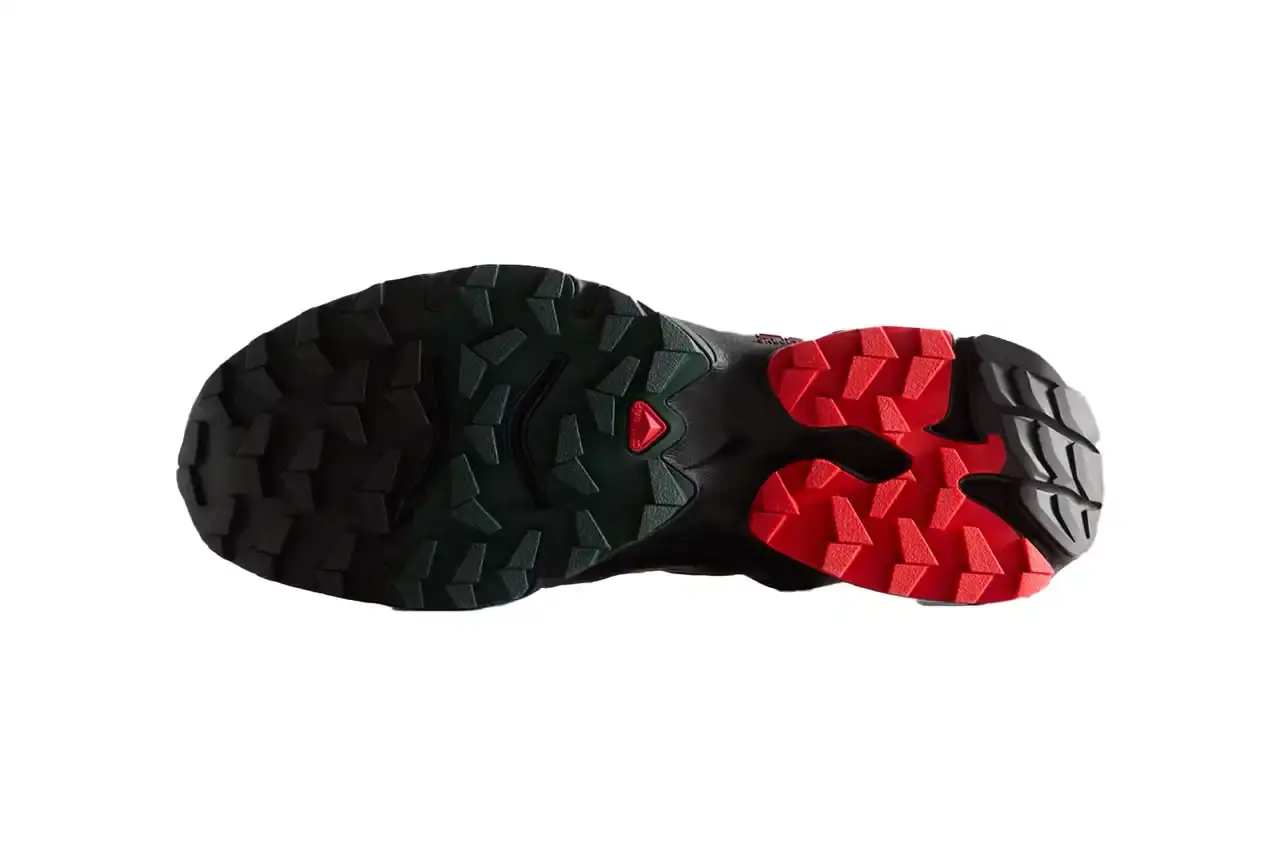 Kith Kith x Salomon XT-Voyager sneaker shown from side angle, featuring blue, grey, white and red colorway with distinctive zipper closure system. (image 4 of 12)