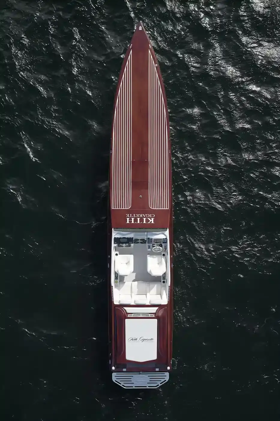 KITH PARTNERS WITH CIGARETTE RACING, BRINGING LUXURY TO WATERS image about the collaboration between fashion brand Kith and boat manufacturer Cigarette Racing. It describes three custom luxury powerboats (the 515, 42' X, and 42' Auroris) with unique design features including custom paint jobs, branded interiors, and integrated technology systems. The article mentions the boats will be available made-to-order beginning May 16 with prices starting at $1.6 million, and that Kith has also created an accompanying apparel collection. (image 10 of 20)