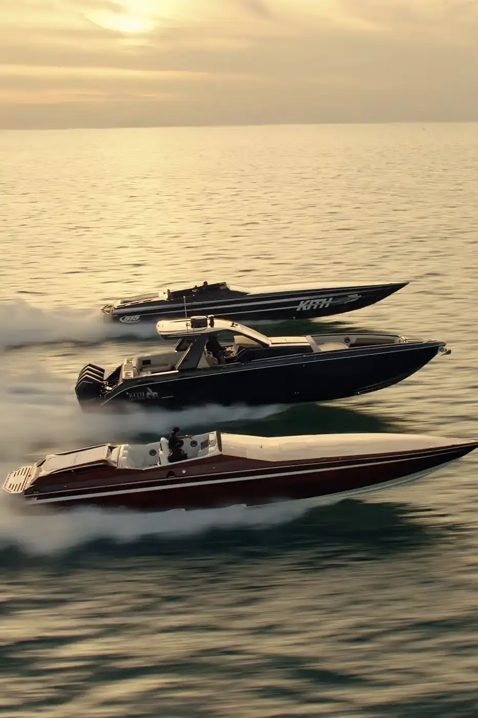 KITH PARTNERS WITH CIGARETTE RACING, BRINGING LUXURY TO WATERS image about the collaboration between fashion brand Kith and boat manufacturer Cigarette Racing. It describes three custom luxury powerboats (the 515, 42' X, and 42' Auroris) with unique design features including custom paint jobs, branded interiors, and integrated technology systems. The article mentions the boats will be available made-to-order beginning May 16 with prices starting at $1.6 million, and that Kith has also created an accompanying apparel collection.