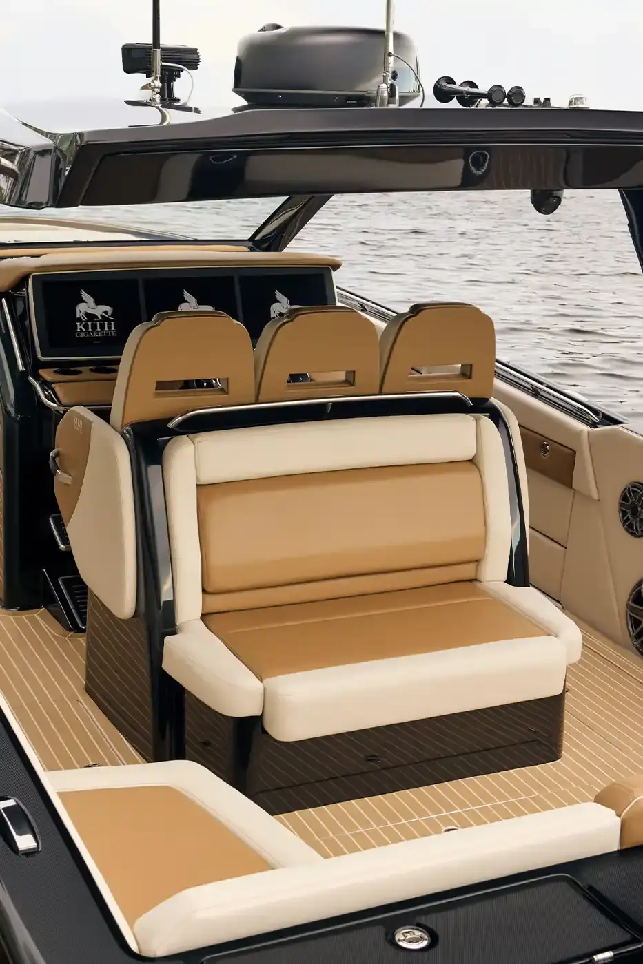 KITH PARTNERS WITH CIGARETTE RACING, BRINGING LUXURY TO WATERS image about the collaboration between fashion brand Kith and boat manufacturer Cigarette Racing. It describes three custom luxury powerboats (the 515, 42' X, and 42' Auroris) with unique design features including custom paint jobs, branded interiors, and integrated technology systems. The article mentions the boats will be available made-to-order beginning May 16 with prices starting at $1.6 million, and that Kith has also created an accompanying apparel collection. (image 18 of 20)