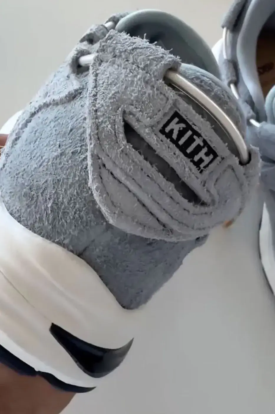 KITH, GIORGIO ARMANI AND ASICS REVEAL THE GEL-MAI 0.1 image about the KITH, Giorgio Armani and ASICS GEL-Mai 0.1, a grey shaggy suede sneaker with navy GEL units and no confirmed release date or price. (image 3 of 5)