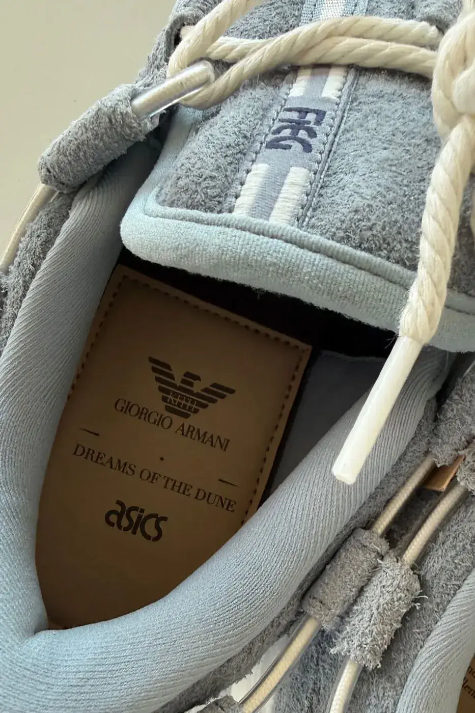 KITH, GIORGIO ARMANI AND ASICS REVEAL THE GEL-MAI 0.1 image about the KITH, Giorgio Armani and ASICS GEL-Mai 0.1, a grey shaggy suede sneaker with navy GEL units and no confirmed release date or price. (image 5 of 5)