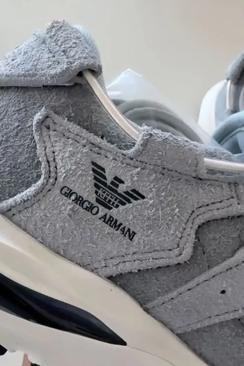 KITH, GIORGIO ARMANI AND ASICS REVEAL THE GEL-MAI 0.1 image about the KITH, Giorgio Armani and ASICS GEL-Mai 0.1, a grey shaggy suede sneaker with navy GEL units and no confirmed release date or price. (image 4 of 5)