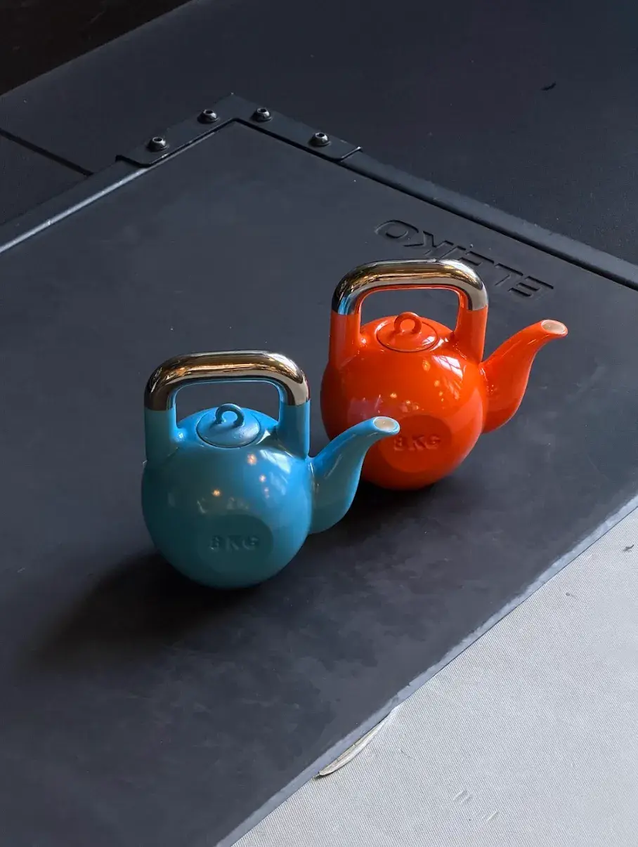 KPM BERLIN AND SUCUK UND BRATWURST DROP A KETTLEBELL TEAPOT image about a limited edition porcelain teapot shaped like a kettlebell, made in collaboration between KPM Berlin and Sucuk und Bratwurst, available from June 2026. (image 3 of 9)