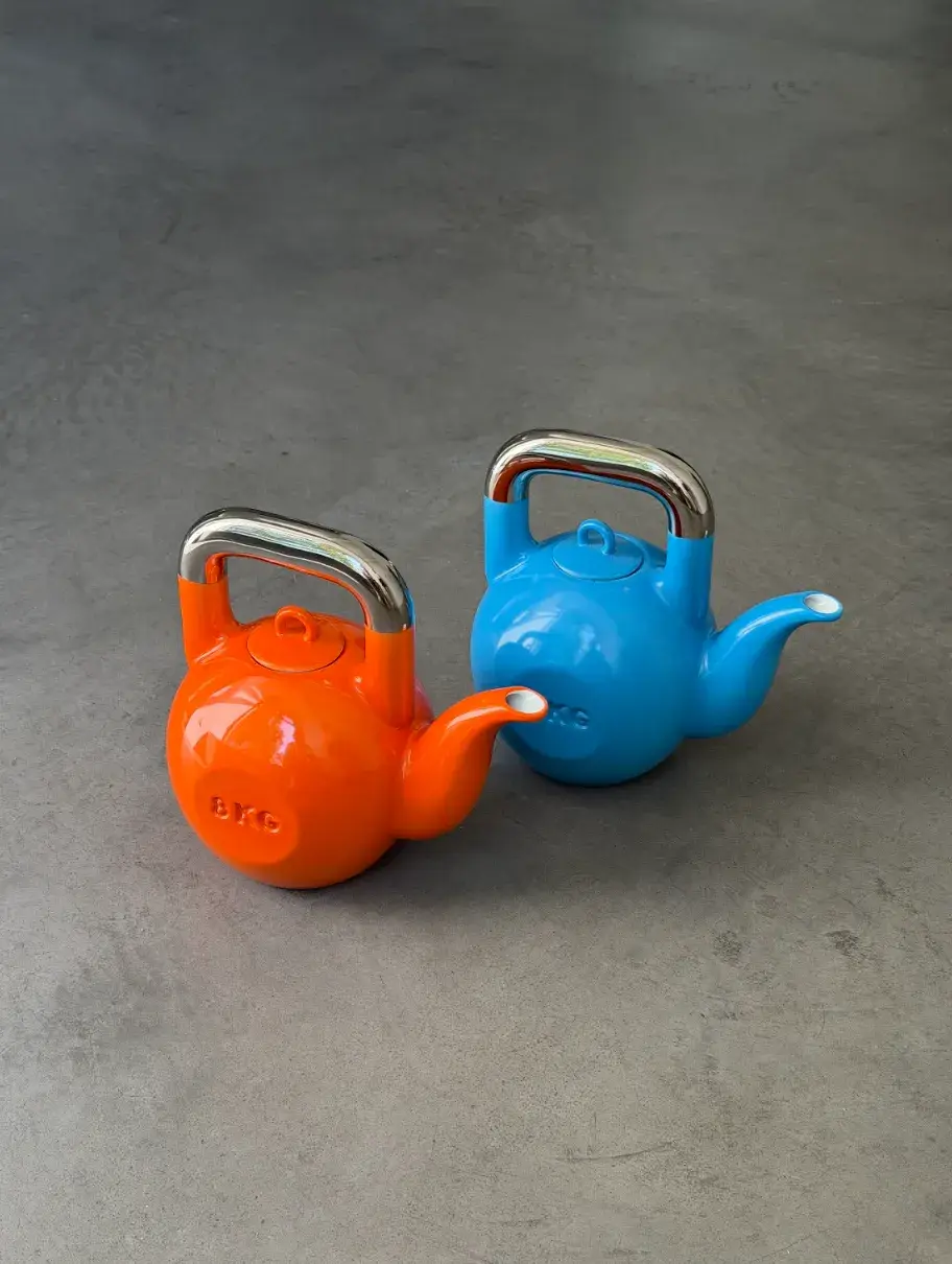 KPM BERLIN AND SUCUK UND BRATWURST DROP A KETTLEBELL TEAPOT image about a limited edition porcelain teapot shaped like a kettlebell, made in collaboration between KPM Berlin and Sucuk und Bratwurst, available from June 2026.