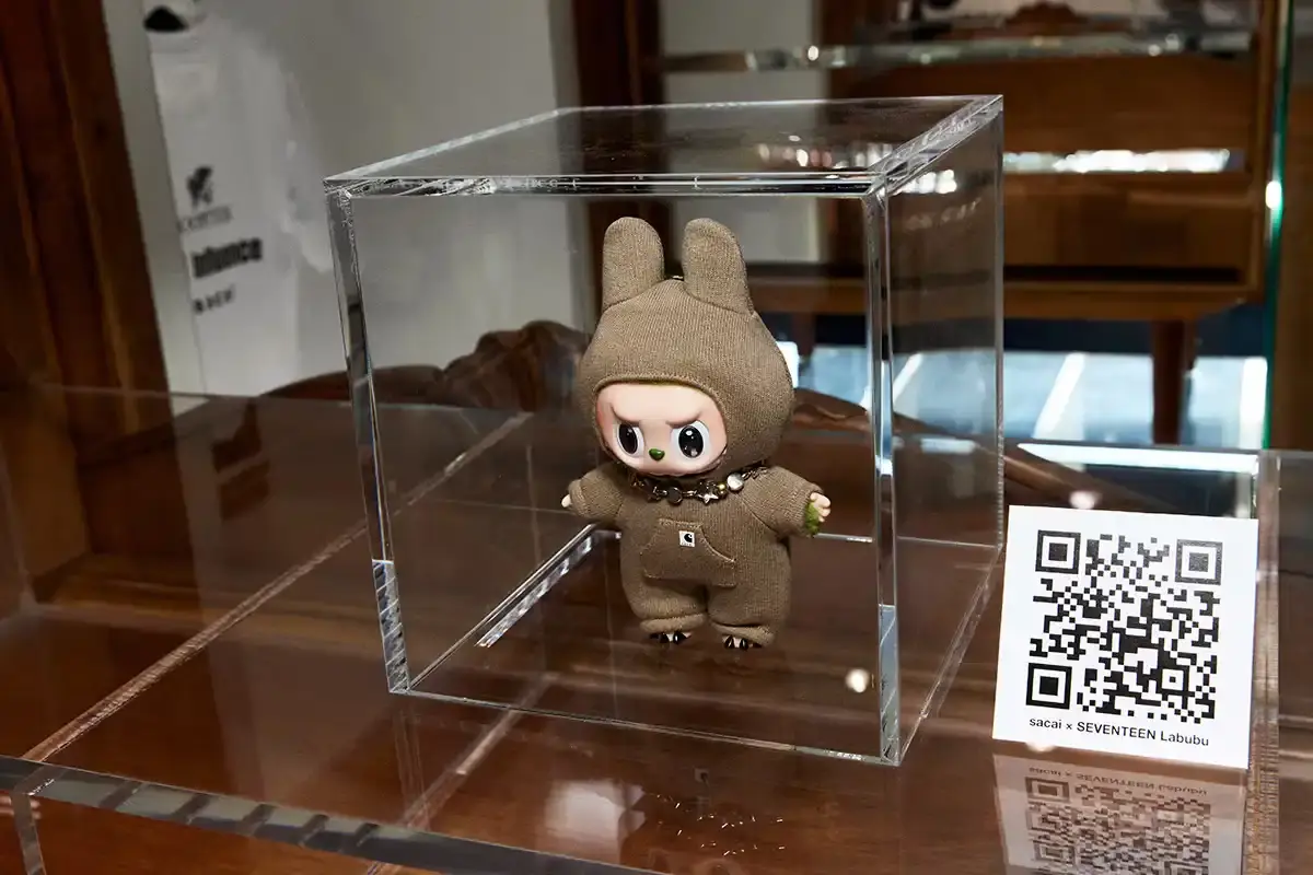 LABUBU COLLECTIBLES REACH NEW AUCTION HEIGHTS Article reports on a successful auction featuring 14 custom LABUBU collectibles designed through a collaboration between fashion brand sacai and K-pop group SEVENTEEN. The auction achieved complete sales totaling $337,500, with one collectible setting a new record at $31,250. All proceeds benefit UNESCO through the organization's partnerships with SEVENTEEN and Pharrell Williams as goodwill ambassadors. The text includes details about the collectibles' design, auction highlights, and market significance. (image 13 of 16)