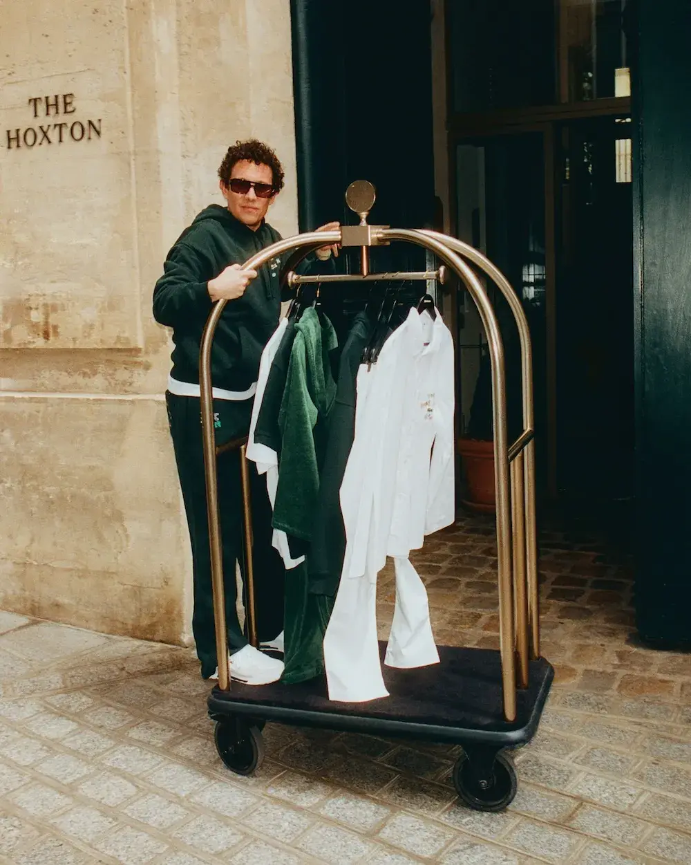 LACOSTE AND THE HOXTON LAUNCH ROOM SERVICE COLLECTION The Hoxton and Lacoste release a seven-piece apparel collection. Guests purchase items directly from their rooms at 19 hotel locations globally. (image 3 of 6)