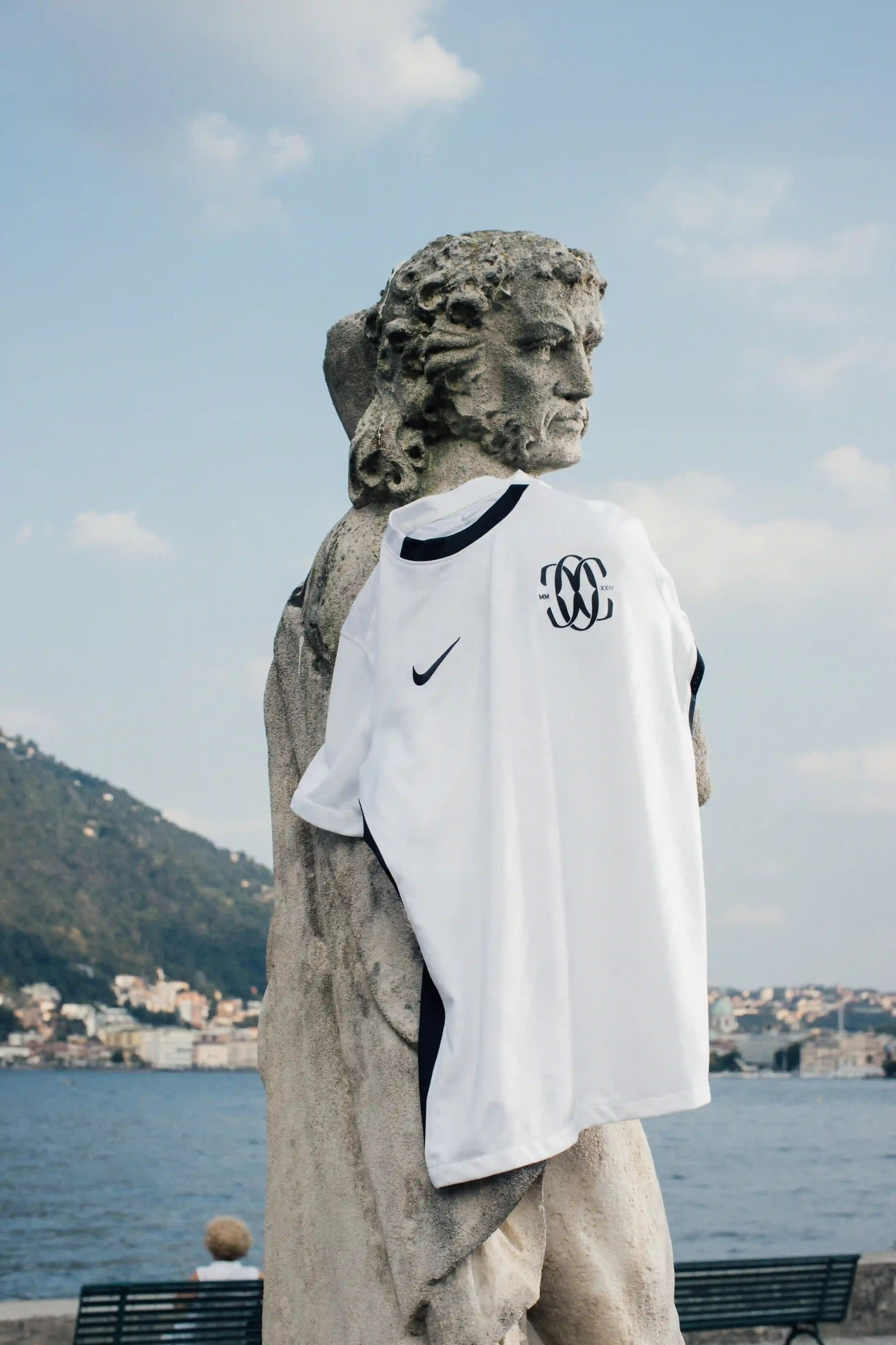 Detailed view of F.C. Como Women's 24/25 away kit, showcasing crisp white design with subtle local patterns