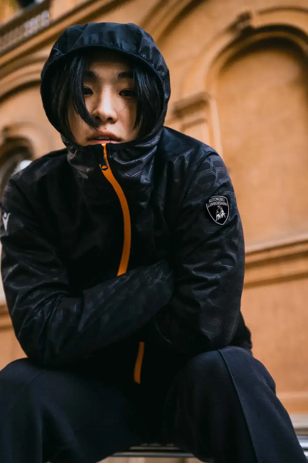 Lamborghini x Macron Lamborghini x Macron activewear collection featuring sports clothing in orange, blue, green, and purple, showcasing technical athletic wear inspired by luxury automotive design (image 5 of 5)