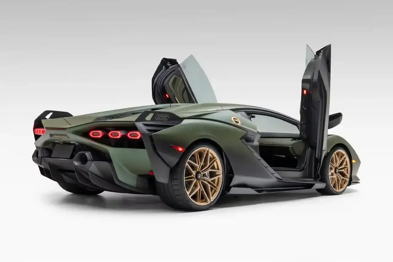 Bring A Trailer Verde Triton 2021 Lamborghini Sián FKP 37 hybrid supercar with gold wheels photographed in profile view showing its aerodynamic design. (image 5 of 9)