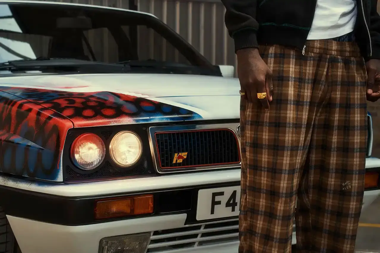 Spot A Lancia Delta Integrale rally car painted by artist Slawn, featuring bold artistic interpretations of the classic Martini racing livery with contemporary street art elements. (image 3 of 13)