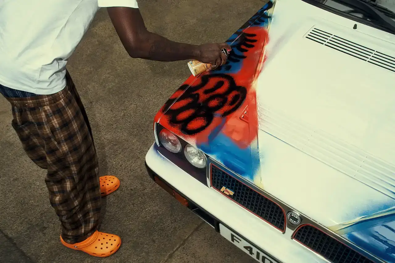 Spot A Lancia Delta Integrale rally car painted by artist Slawn, featuring bold artistic interpretations of the classic Martini racing livery with contemporary street art elements. (image 10 of 13)