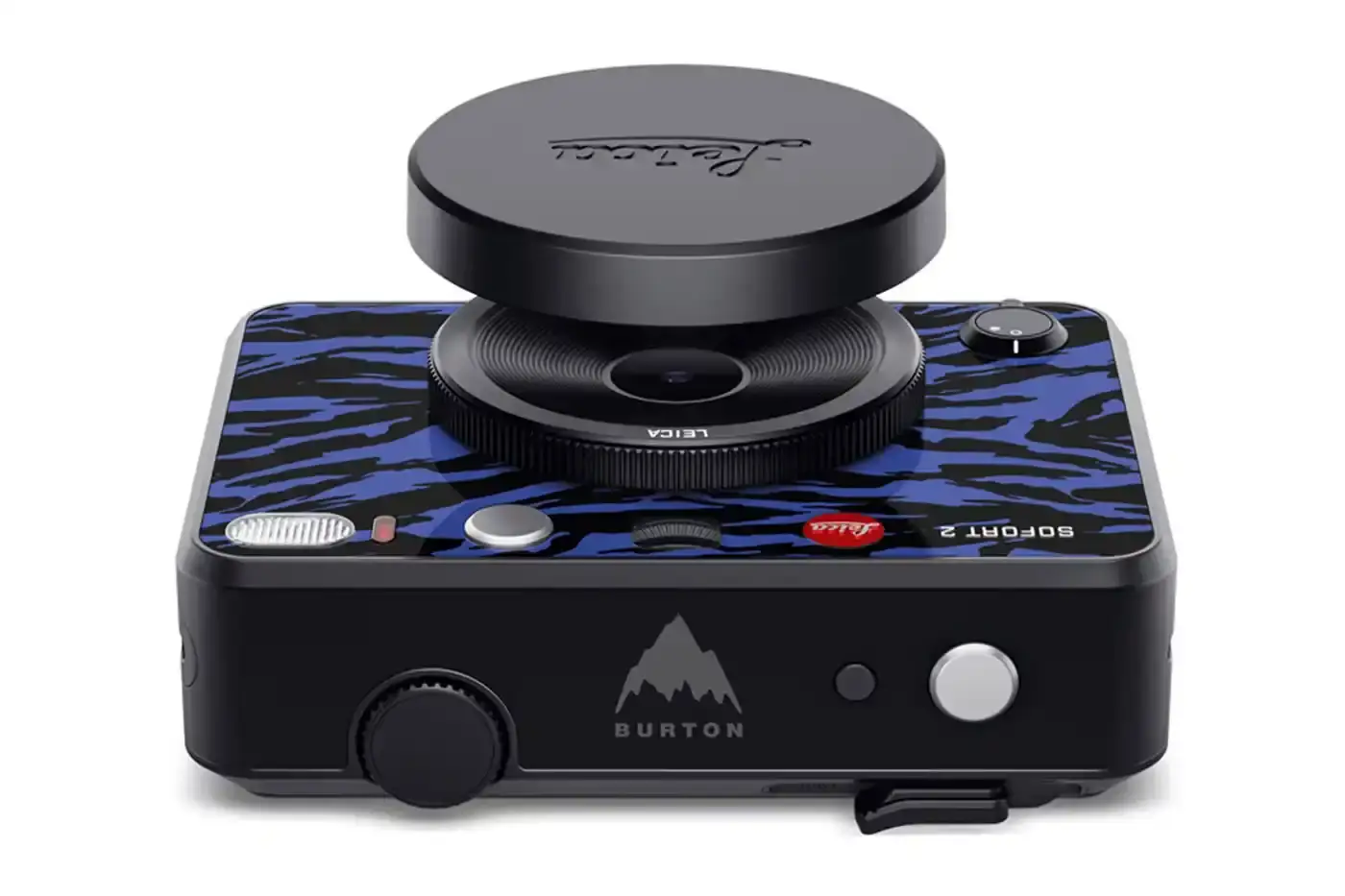 Leica The Leica SOFORT 2 Burton Edition instant camera, featuring Burton's signature pattern on a black camera body with the Burton logo on top. A matching Burton-designed camera bag sits beside it. (image 4 of 6)