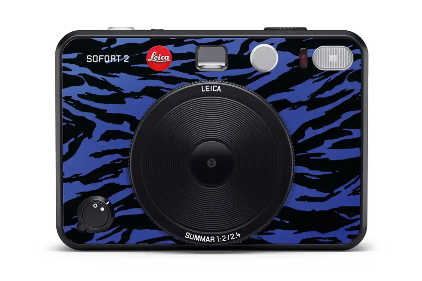 Leica The Leica SOFORT 2 Burton Edition instant camera, featuring Burton's signature pattern on a black camera body with the Burton logo on top. A matching Burton-designed camera bag sits beside it. (image 3 of 6)