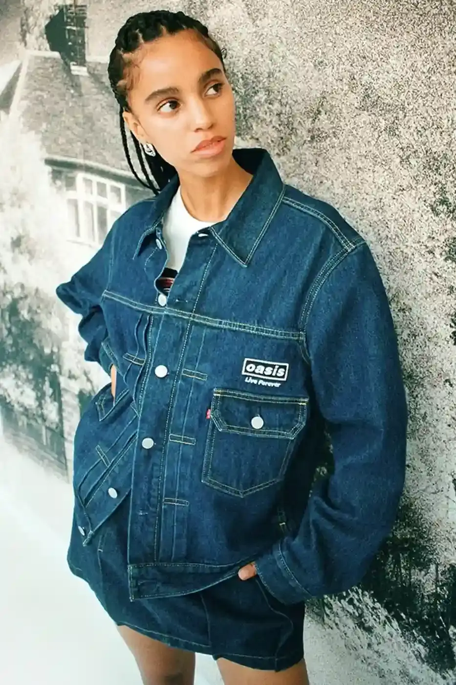LEVI'S OASIS COLLECTION MARKS BAND'S RETURN image of Levi's new clothing collection inspired by British rock band Oasis, featuring T-shirts with vintage logos and denim pieces including Liam Gallagher's signature parka style. Collection currently available in Europe with worldwide release planned for 2025 (image 10 of 15)