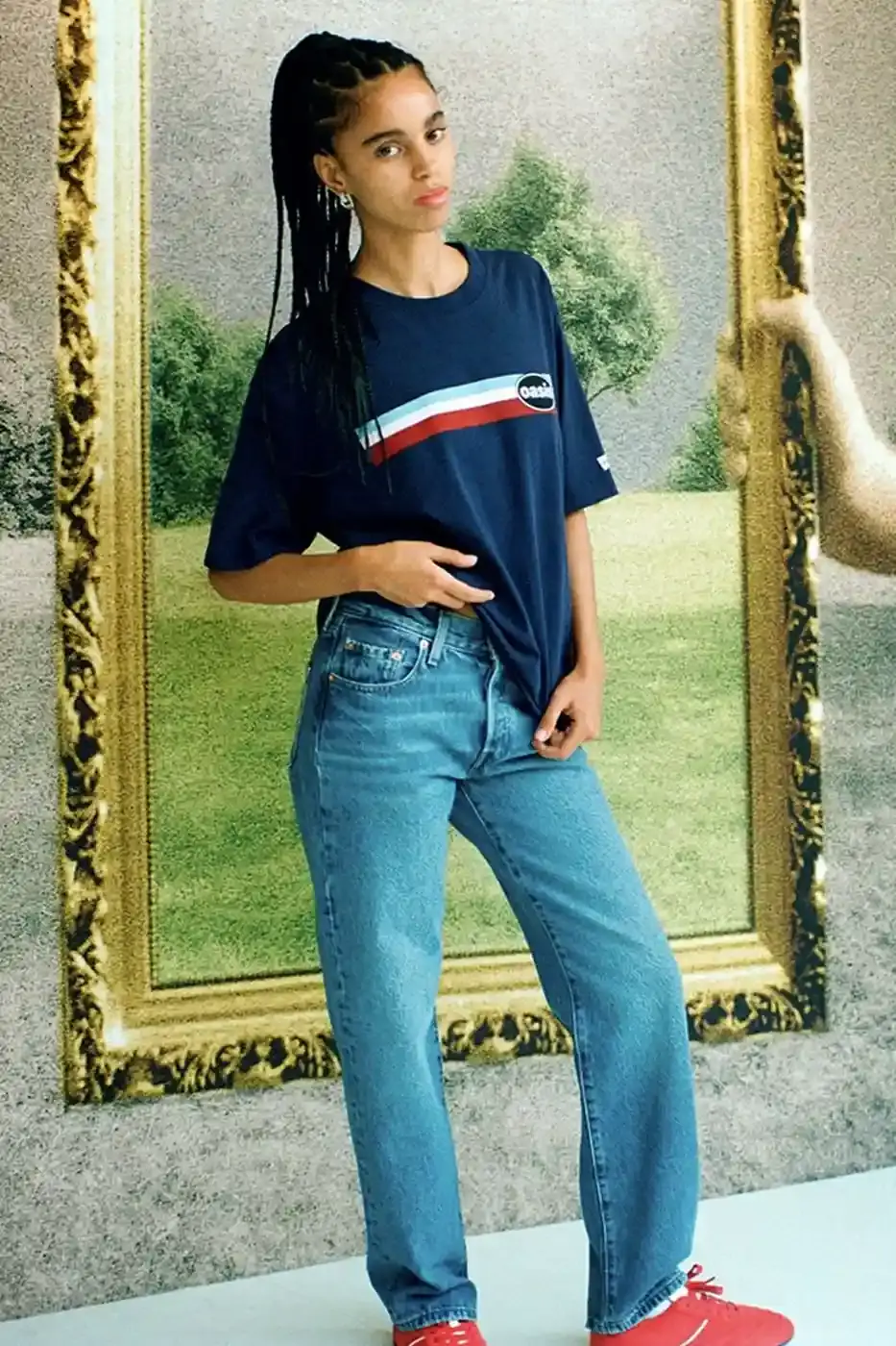 LEVI'S OASIS COLLECTION MARKS BAND'S RETURN image of Levi's new clothing collection inspired by British rock band Oasis, featuring T-shirts with vintage logos and denim pieces including Liam Gallagher's signature parka style. Collection currently available in Europe with worldwide release planned for 2025 (image 11 of 15)