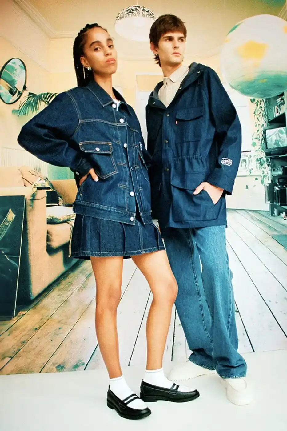 LEVI'S OASIS COLLECTION MARKS BAND'S RETURN image of Levi's new clothing collection inspired by British rock band Oasis, featuring T-shirts with vintage logos and denim pieces including Liam Gallagher's signature parka style. Collection currently available in Europe with worldwide release planned for 2025 (image 15 of 15)