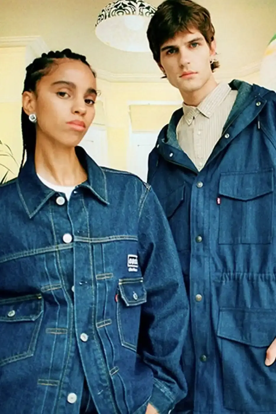 LEVI'S OASIS COLLECTION MARKS BAND'S RETURN image of Levi's new clothing collection inspired by British rock band Oasis, featuring T-shirts with vintage logos and denim pieces including Liam Gallagher's signature parka style. Collection currently available in Europe with worldwide release planned for 2025 (image 6 of 15)
