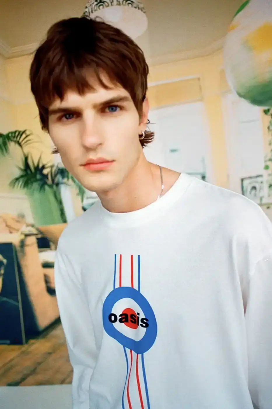 LEVI'S OASIS COLLECTION MARKS BAND'S RETURN image of Levi's new clothing collection inspired by British rock band Oasis, featuring T-shirts with vintage logos and denim pieces including Liam Gallagher's signature parka style. Collection currently available in Europe with worldwide release planned for 2025 (image 13 of 15)
