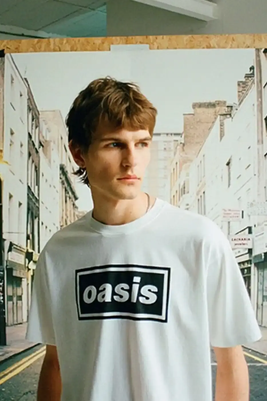 LEVI'S OASIS COLLECTION MARKS BAND'S RETURN image of Levi's new clothing collection inspired by British rock band Oasis, featuring T-shirts with vintage logos and denim pieces including Liam Gallagher's signature parka style. Collection currently available in Europe with worldwide release planned for 2025 (image 4 of 15)