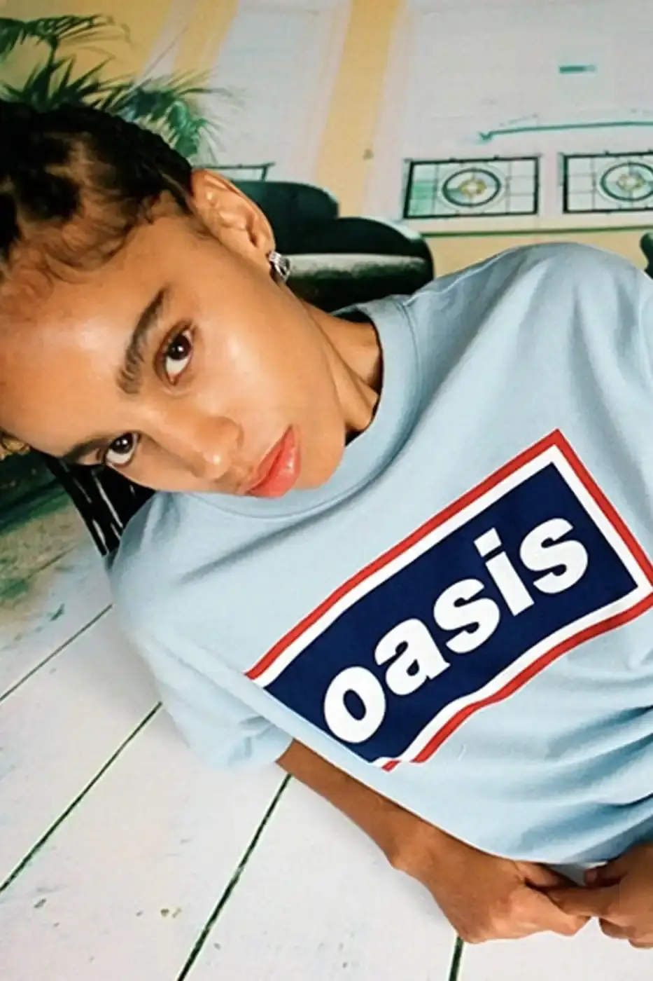 LEVI'S OASIS COLLECTION MARKS BAND'S RETURN image of Levi's new clothing collection inspired by British rock band Oasis, featuring T-shirts with vintage logos and denim pieces including Liam Gallagher's signature parka style. Collection currently available in Europe with worldwide release planned for 2025 (image 7 of 15)