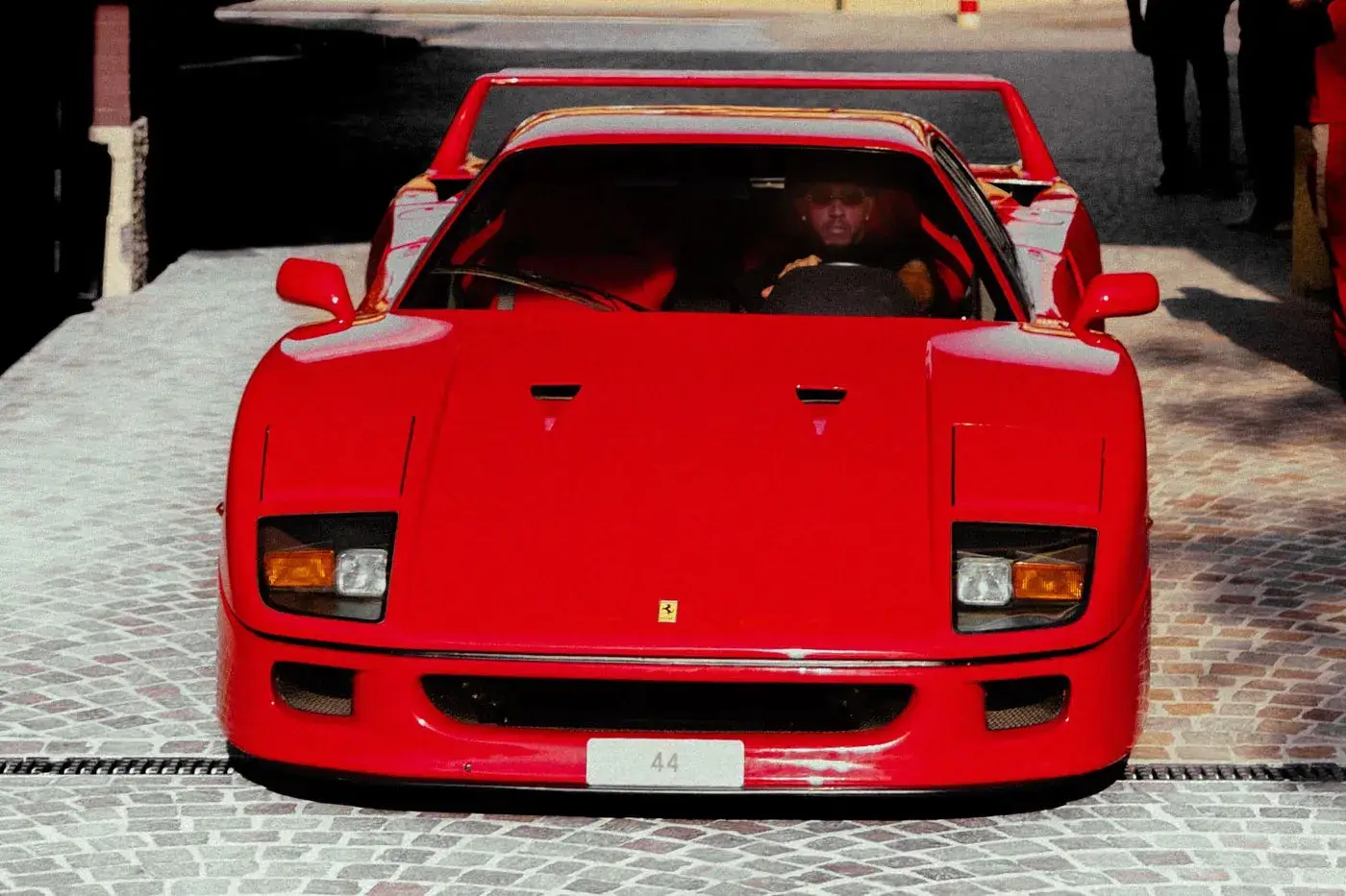 LEWIS HAMILTON DRIVES FERRARI F40 TO MONZA image of Lewis Hamilton arriving at the Monza circuit in a rare Ferrari F40 with engine number 44. (image 5 of 5)