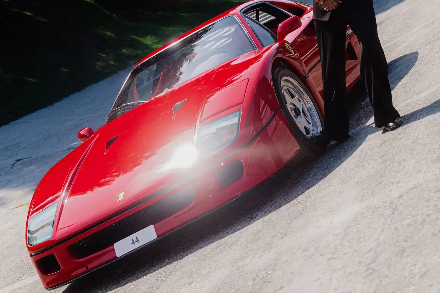 LEWIS HAMILTON DRIVES FERRARI F40 TO MONZA image of Lewis Hamilton arriving at the Monza circuit in a rare Ferrari F40 with engine number 44. (image 3 of 5)