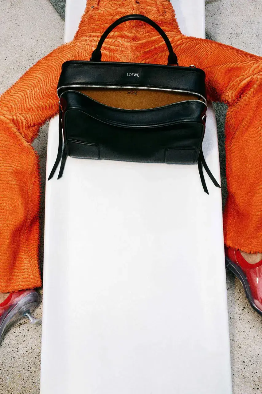 LIL YACHTY LEADS LOEWE FALL CAMPAIGN image detailing musician Lil Yachty and actress Julia Garner starring in a LOEWE fashion campaign filmed in the Alps. (image 3 of 11)