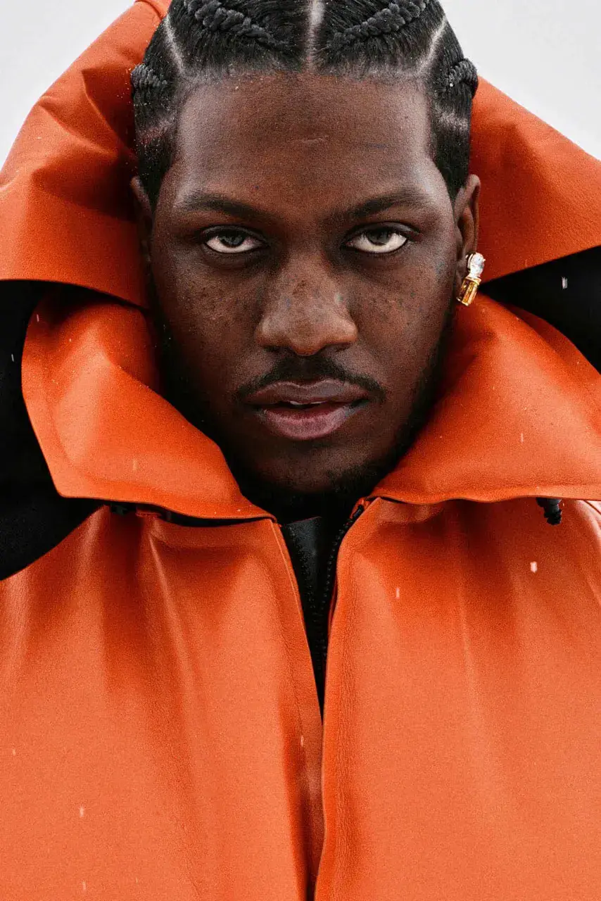 LIL YACHTY LEADS LOEWE FALL CAMPAIGN image detailing musician Lil Yachty and actress Julia Garner starring in a LOEWE fashion campaign filmed in the Alps.