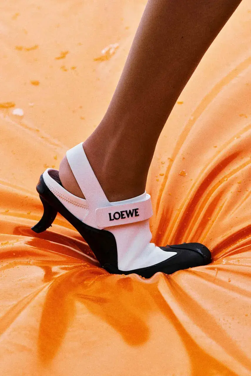 LIL YACHTY LEADS LOEWE FALL CAMPAIGN image detailing musician Lil Yachty and actress Julia Garner starring in a LOEWE fashion campaign filmed in the Alps. (image 10 of 11)