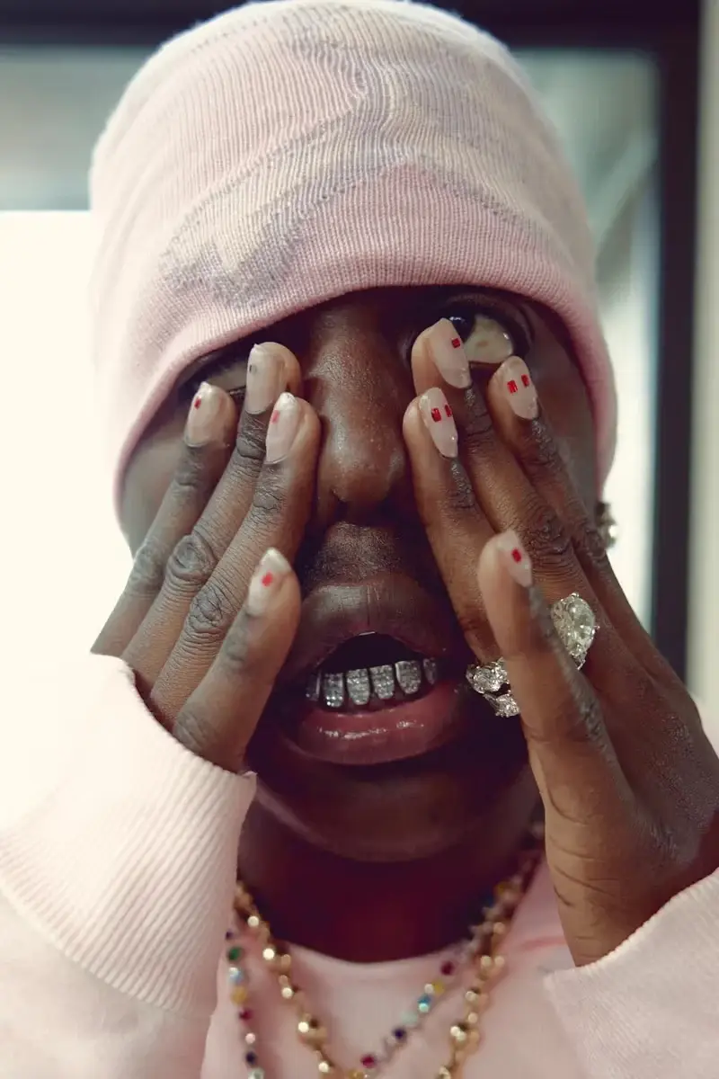 Lil Yachty, Camo!, and Draft Day of Concrete Boys modeling PDF by Domenico Formichetti's Fall/Winter 2024 collection 'The Dirt'. Yachty wears oversized pastel denim shorts and cardigan with moon shoes. Group shot through fish-eye lens capturing '90s street style aesthetic (image 3 of 3)
