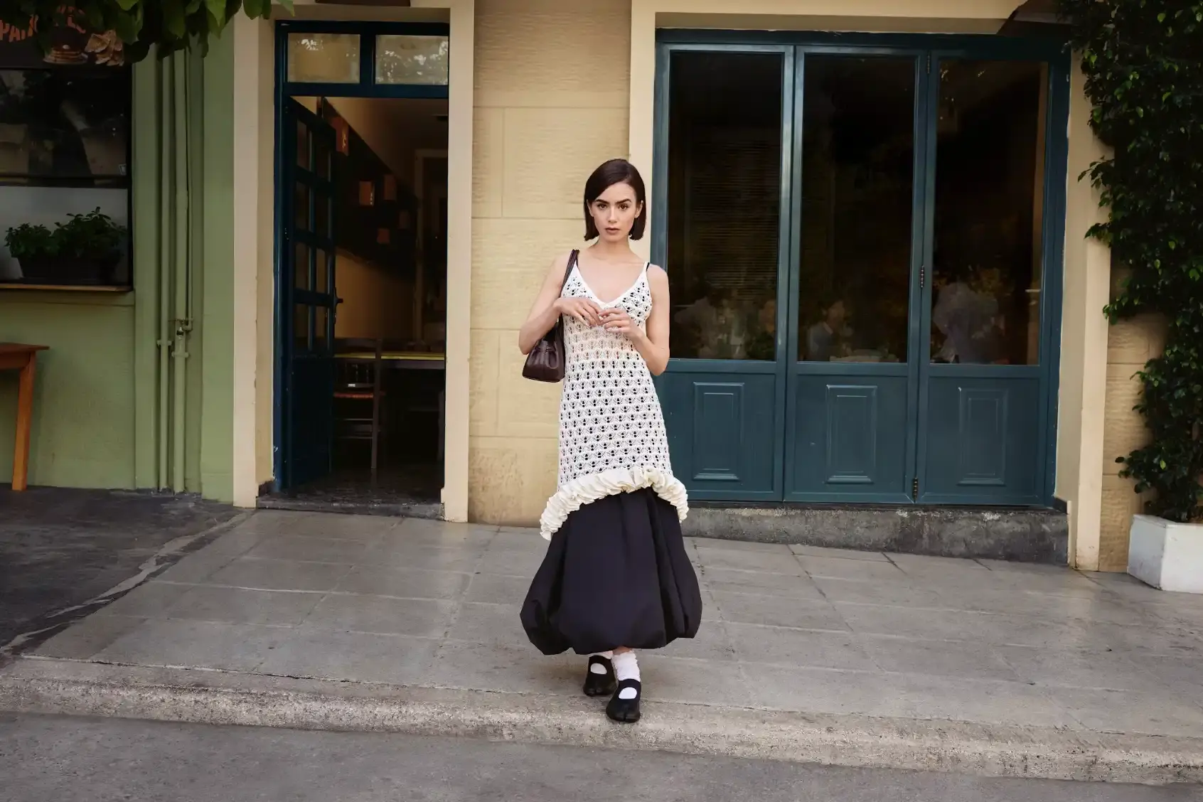 The article discusses the appointment of actress Lily Collins as the global brand ambassador for fashion platform Zalando. It details the upcoming campaigns for 2026, the focus on self expression, and quotes from both Collins and Zalando executives regarding the partnership's goals.