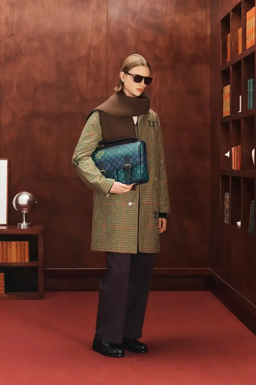 LOUIS VUITTON FALL 2026 MENSWEAR PREVIEW image about Louis Vuitton's upcoming Fall 2026 menswear collection designed by Pharrell Williams. The piece discusses the collection's American collegiate inspiration, key design elements including tartan patterns and heritage stripes, outerwear focus, and September release timeline. Contains detailed descriptions of clothing items, patterns, materials, and accessories without accompanying images. (image 17 of 29)
