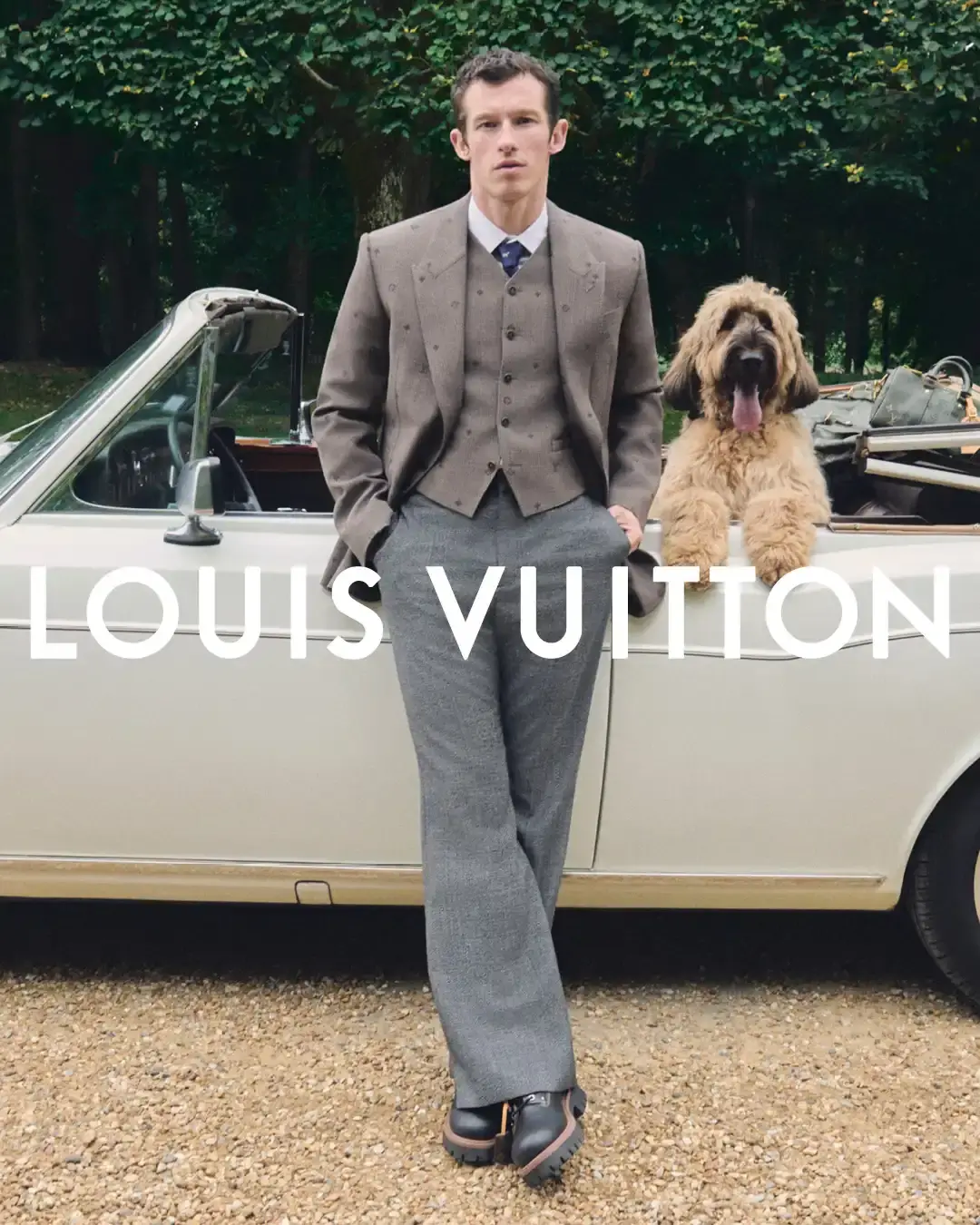 LOUIS VUITTON MEN'S PRE-COLLECTION 2026 Louis Vuitton Men's Pre-Collection Spring/Summer 2026 campaign photographed in the English countryside, showcasing tailored pieces, streetwear elements, and a pet accessories capsule. (image 3 of 3)