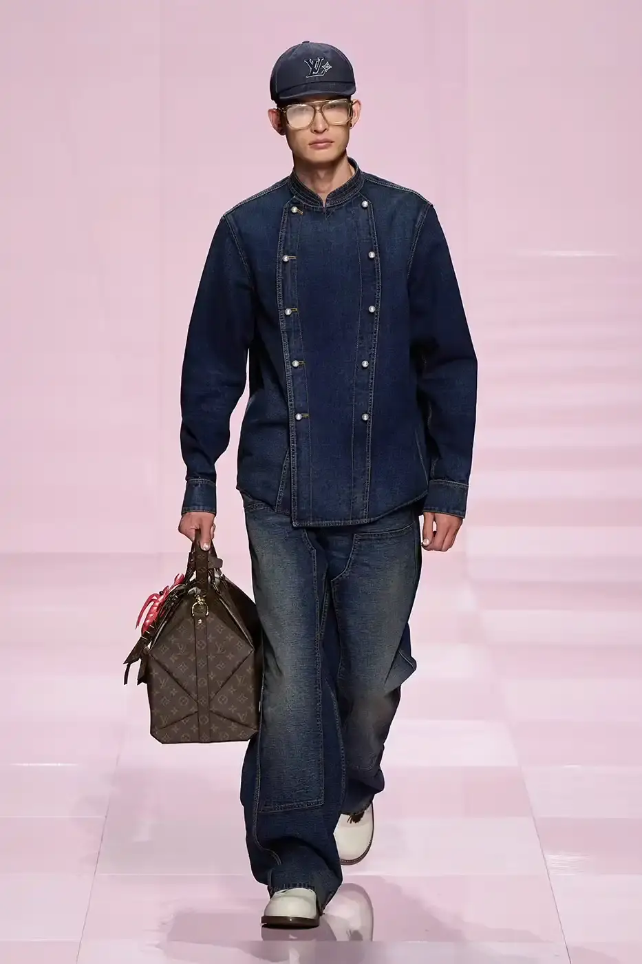 Louis Vuitton Louis Vuitton's Fall/Winter 2025 menswear collection, detailing the creative collaboration between Pharrell Williams and NIGO, featuring streetwear elements, Japanese craftsmanship, and French luxury design, with references to historical brand elements and new patterns. (image 11 of 23)