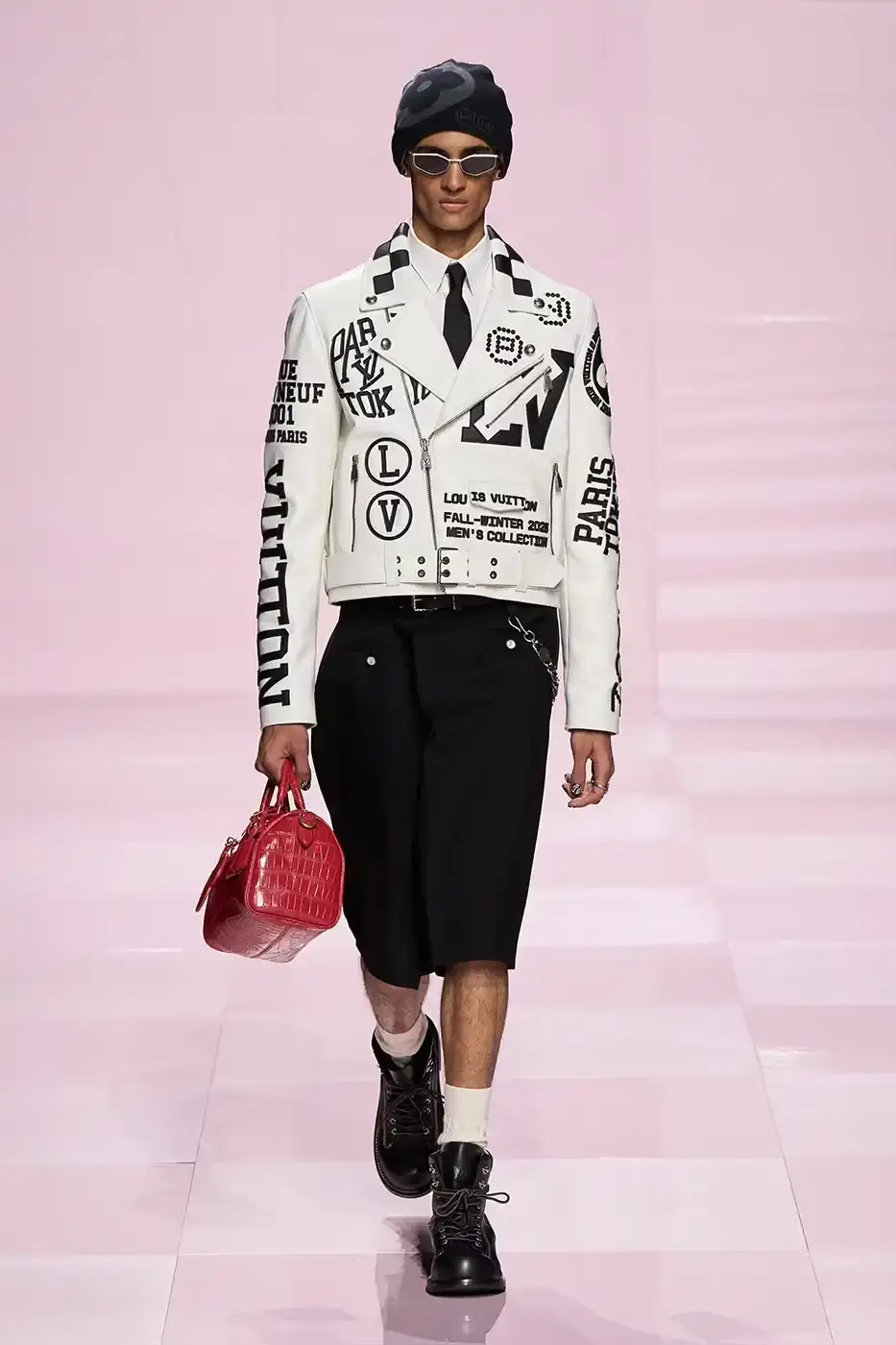 Louis Vuitton Louis Vuitton's Fall/Winter 2025 menswear collection, detailing the creative collaboration between Pharrell Williams and NIGO, featuring streetwear elements, Japanese craftsmanship, and French luxury design, with references to historical brand elements and new patterns. (image 3 of 23)