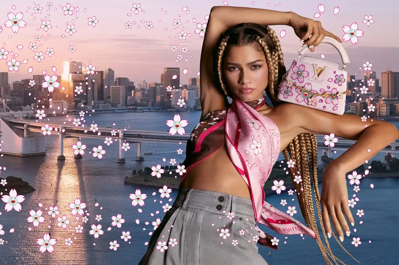 Louis Vuitton Zendaya modeling Louis Vuitton's new Cherry Blossom collection by Takashi Murakami, showcasing pink floral patterns on classic LV bags and accessories against a minimal background.