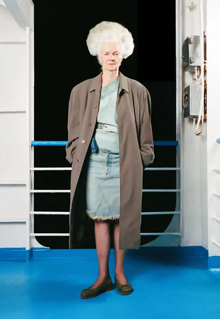 MAGLIANO SHOWS SS26 COLLECTION VIA FERRY FILM image about Italian designer Luca Magliano's Spring/Summer 2026 menswear collection, presented as a film aboard a ferry during Milan Fashion Week. The collection features camping and nomadic influences, with repurposed materials, loose silhouettes, and collaborative footwear including Beja soccer sneakers and 1900s-inspired boots. Shoot by Leonardo Scotti. (image 16 of 16)