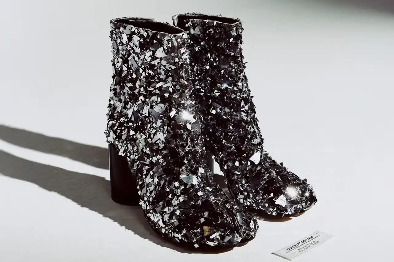 Article about Maison Margiela's new limited edition Tabi Collector's Series featuring hand-embroidered Broken Mirror design with 8,000 glass beads per pair.