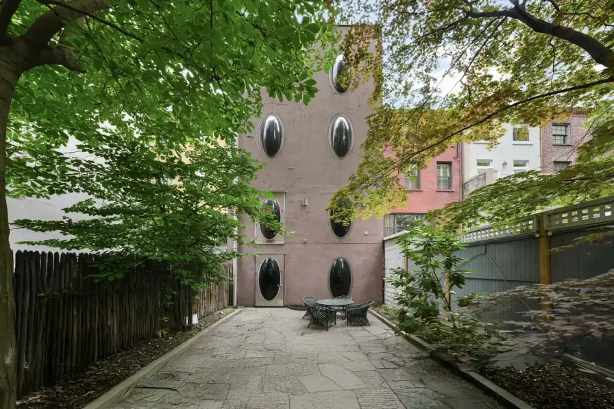 MANHATTAN'S 1960S BUBBLE HOUSE LISTS FOR $5.75M image about a unique Manhattan townhouse featuring circular windows, designed by architect Maurice Medcalfe in 1969, now for sale at $5.75 million. Includes property details, architectural history, and neighborhood context. (image 5 of 5)
