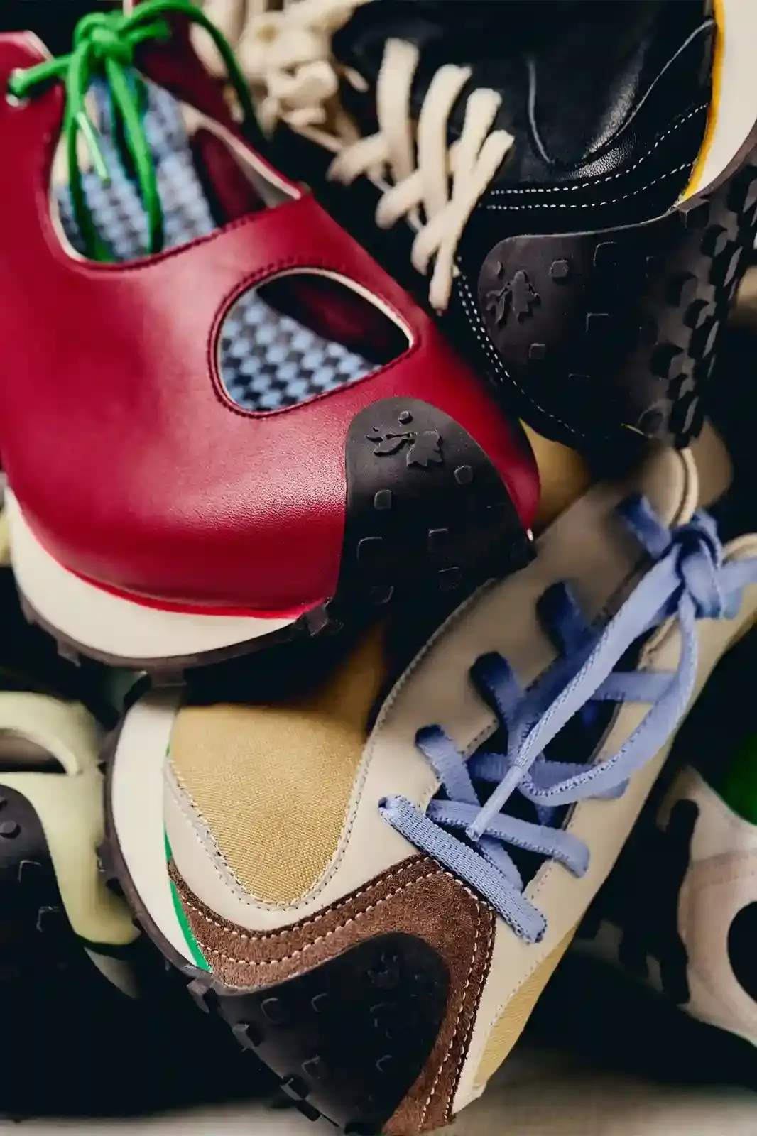 image about French footwear designer Martin Sallières, who has launched his own shoe label in Stockholm after designing for brands like Filling Pieces and Sunnei. The piece covers his design philosophy focused on precise proportions and honest craftsmanship, his journey from working for established brands to creating his own collection, and his plans for direct-to-consumer sales launching in early 2026. The article emphasizes his deliberate, unhurried approach to building a brand in contrast to the fast-paced fashion industry, highlighting his unisex designs that include sneakers with unique proportions and sandals inspired by personal memories.
