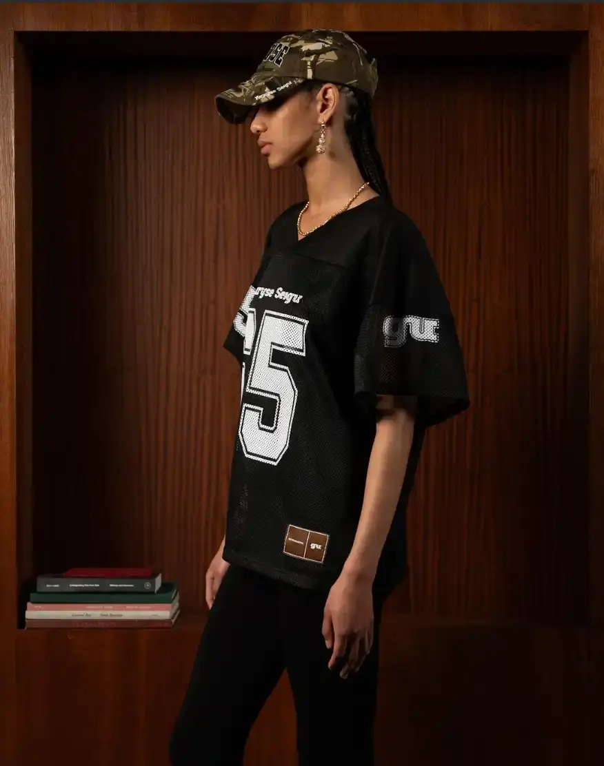 MARYSE SEIGU HONORS OLYMPIC PIONEER IN NEW COLLECTION image about the launch of Maryse Seigu's third fashion collection "CANGUIO S/S 25," which pays tribute to Marlene Canguio, the first woman from Guadeloupe to compete in the Olympic Games. The piece discusses the 13-item athletic-inspired collection that combines Caribbean cultural heritage with contemporary urban fashion, key pieces named after notable Afro-Caribbean athletes, and details about the brand's visual storytelling approach. The article includes information about a launch event in New York on May 23, 2025, and online availability starting May 29, 2025. (image 4 of 6)