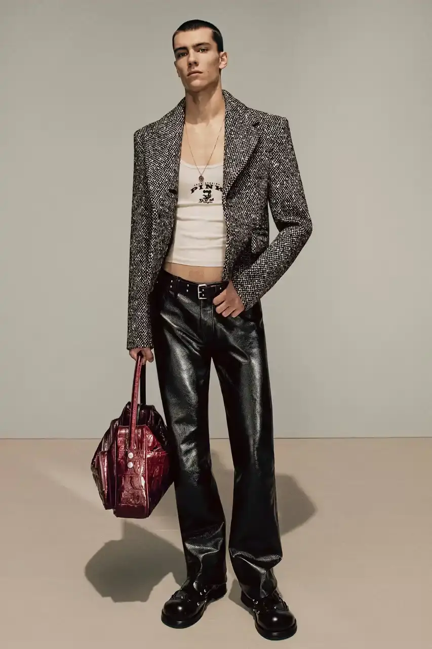 Acne Studios Model in 1970s-inspired checked two-piece suit from Acne Studios FW25 collection (image 21 of 24)