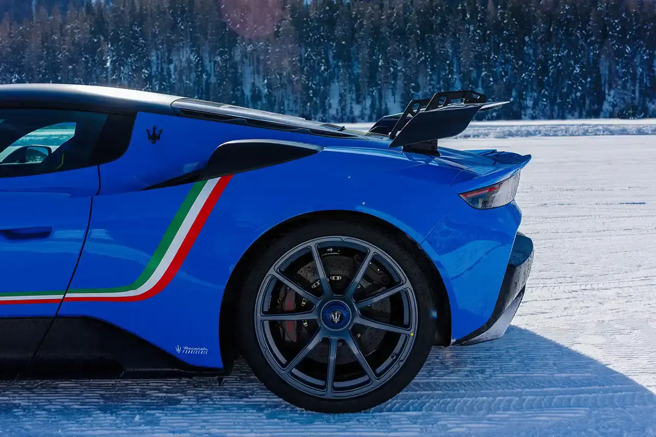 Maserati 2024 Maserati GranCabrio convertible in profile view, parked on snow with Swiss Alps in background at St. Moritz (image 9 of 9)